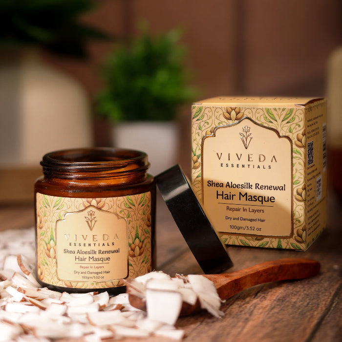 Viveda Essentials Shea Aloesilk Renewal Hair Masque with packaging on a wooden surface.